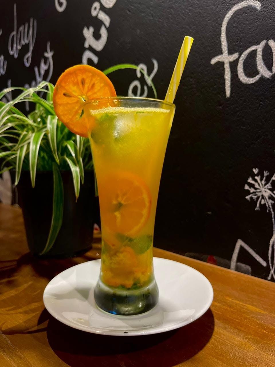 Orange mojito with fresh orange garnish at Café R2